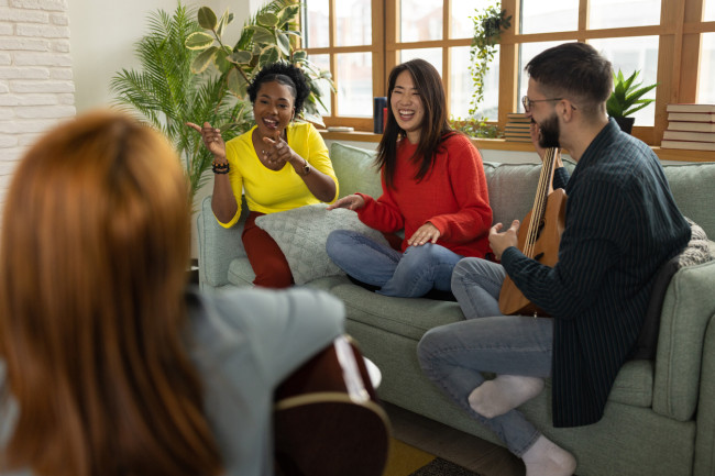 Group of friends playing instruments and singing