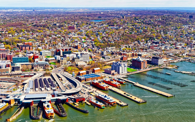 Aerial view of Staten Island St George Ferry terminal. Manhattan Area, New York of USA. Skyline and cityscape with skyscrapers at United States of America, NYC, US. American architecture.