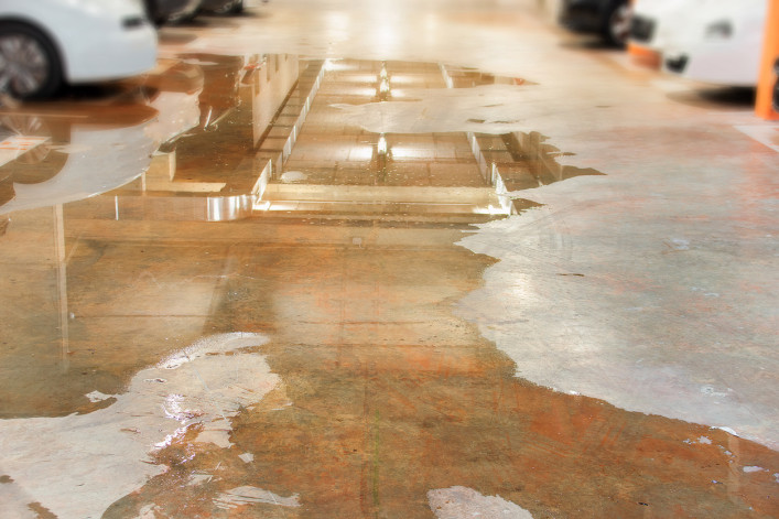 Parking flooded with water due to external leaks