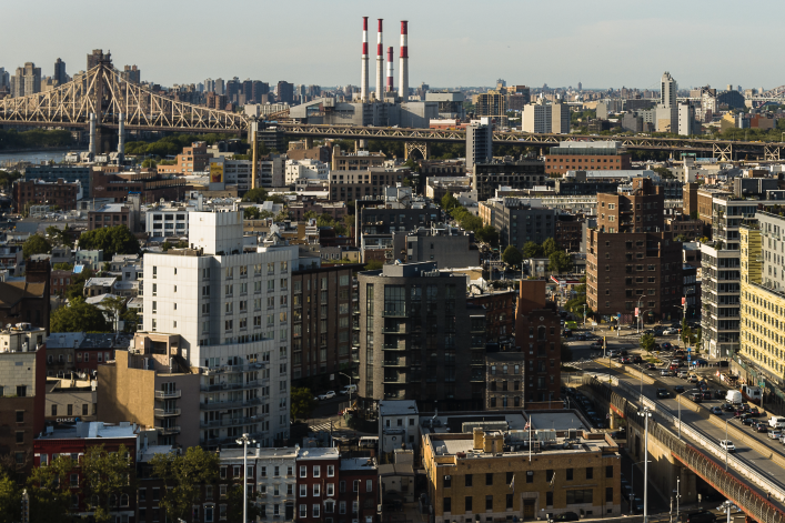 Traffic on Pulaski bridge in Long Island City. Panoramic view of Astoria, Roosevelt Island and Upper East Side Manhattan over the Queensboro Bridge.