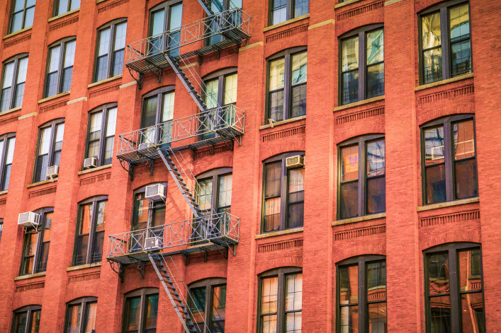 A brick new york city apartment facade. 