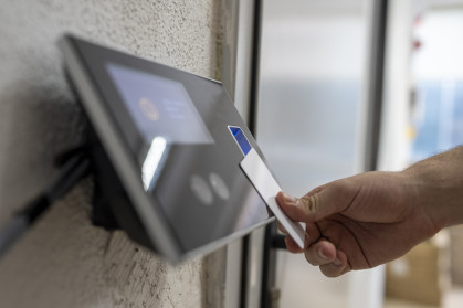 Male hand holding key card to accessing the room stock photo