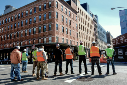 construction workers standing on a street in New York