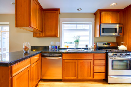 dated orange wood cabinets brick underground