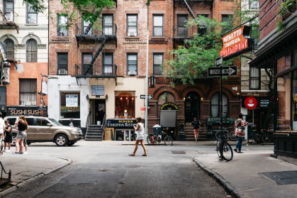 Stores and business in MacDougal Street in Greenwich Village. It has been called the most colorful and magnetic venue for tourists in the Village