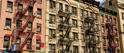 Low rise apartment buildings with ground-floor storefronts