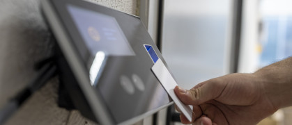 Male hand holding key card to accessing the room stock photo