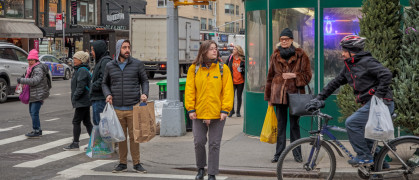 New Yorkers waiting to cross Lexington Avenue in Manhattan.