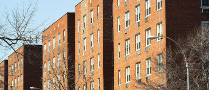 A block of brown apartments in NYC.