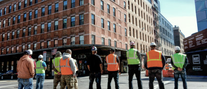 construction workers standing on a street in New York