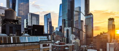 New York City - glass skyscrapers in Hudson Yards with sunlight shining in the skyline background